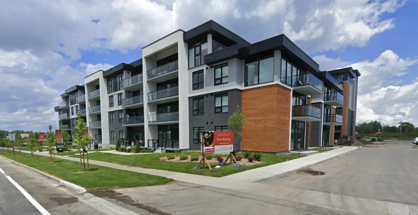 Street-level view of the completed rental apartment building shown in the aerial photograph.